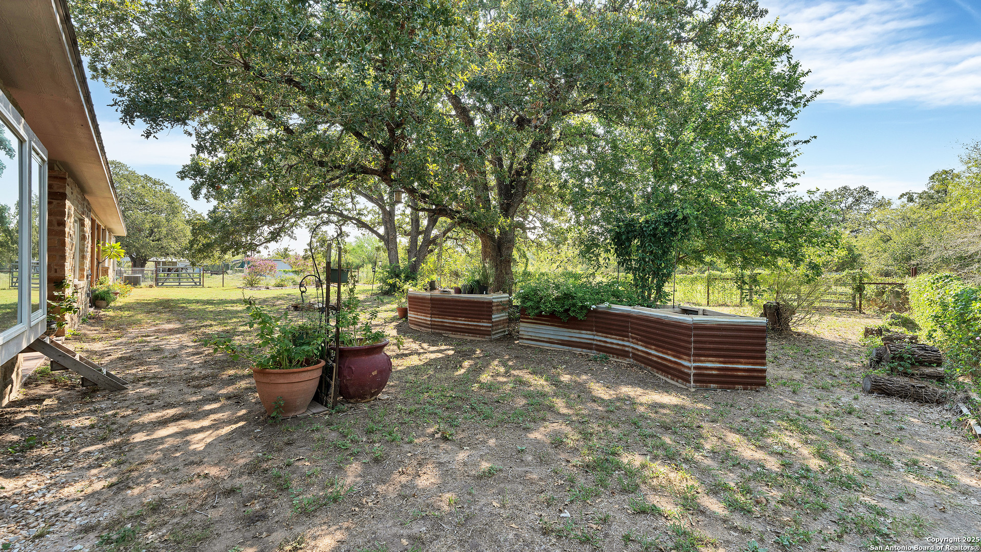 475 Jackson Road Kingsbury, TX 78638 - Photo 37 of 44 a backyard of a house with outdoor seating