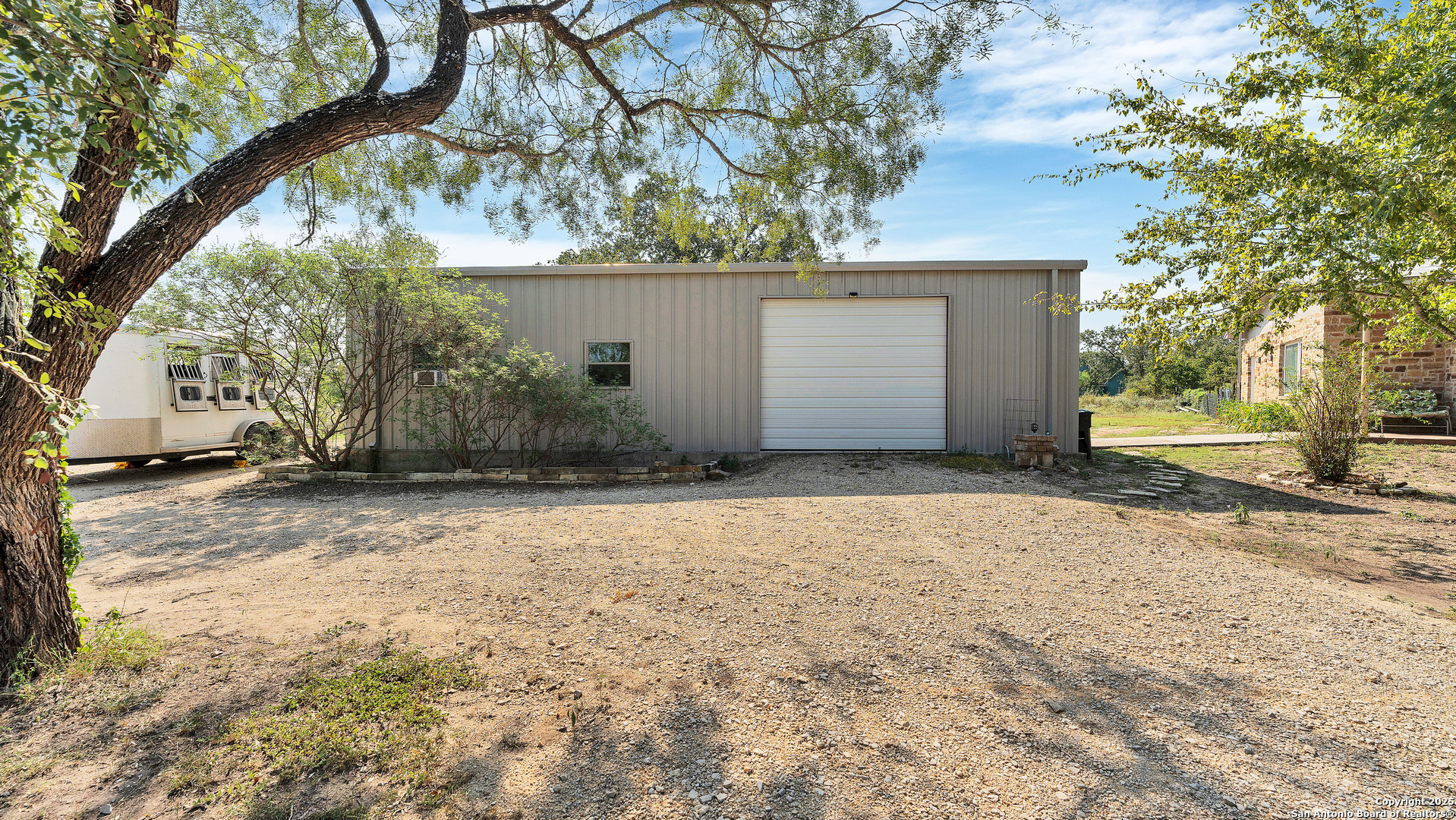 475 Jackson Road Kingsbury, TX 78638 - Photo 39 of 44 a view of a house with a yard and garage