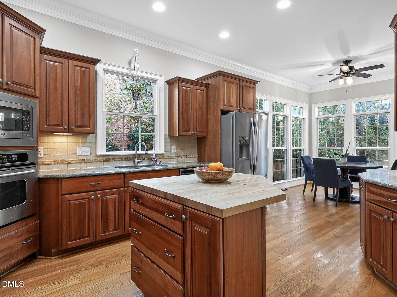 104 River Run Road Durham, NC 27712 - Photo 16 of 41 a kitchen with a sink a counter top space and stainless steel appliances