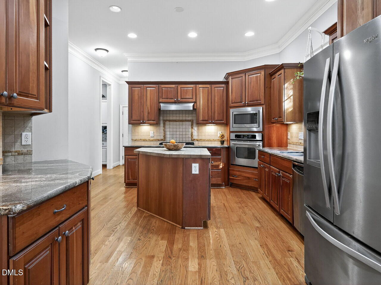 104 River Run Road Durham, NC 27712 - Photo 17 of 41 a kitchen with kitchen island granite countertop stainless steel appliances cabinets a sink and a counter top space