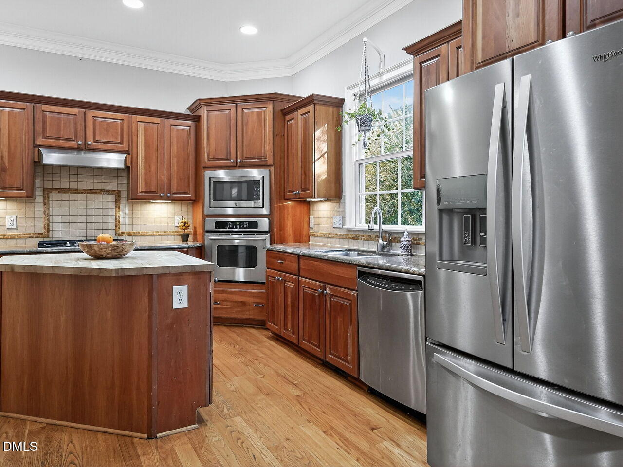 104 River Run Road Durham, NC 27712 - Photo 18 of 41 a kitchen with stainless steel appliances granite countertop a refrigerator a stove a sink and dishwasher