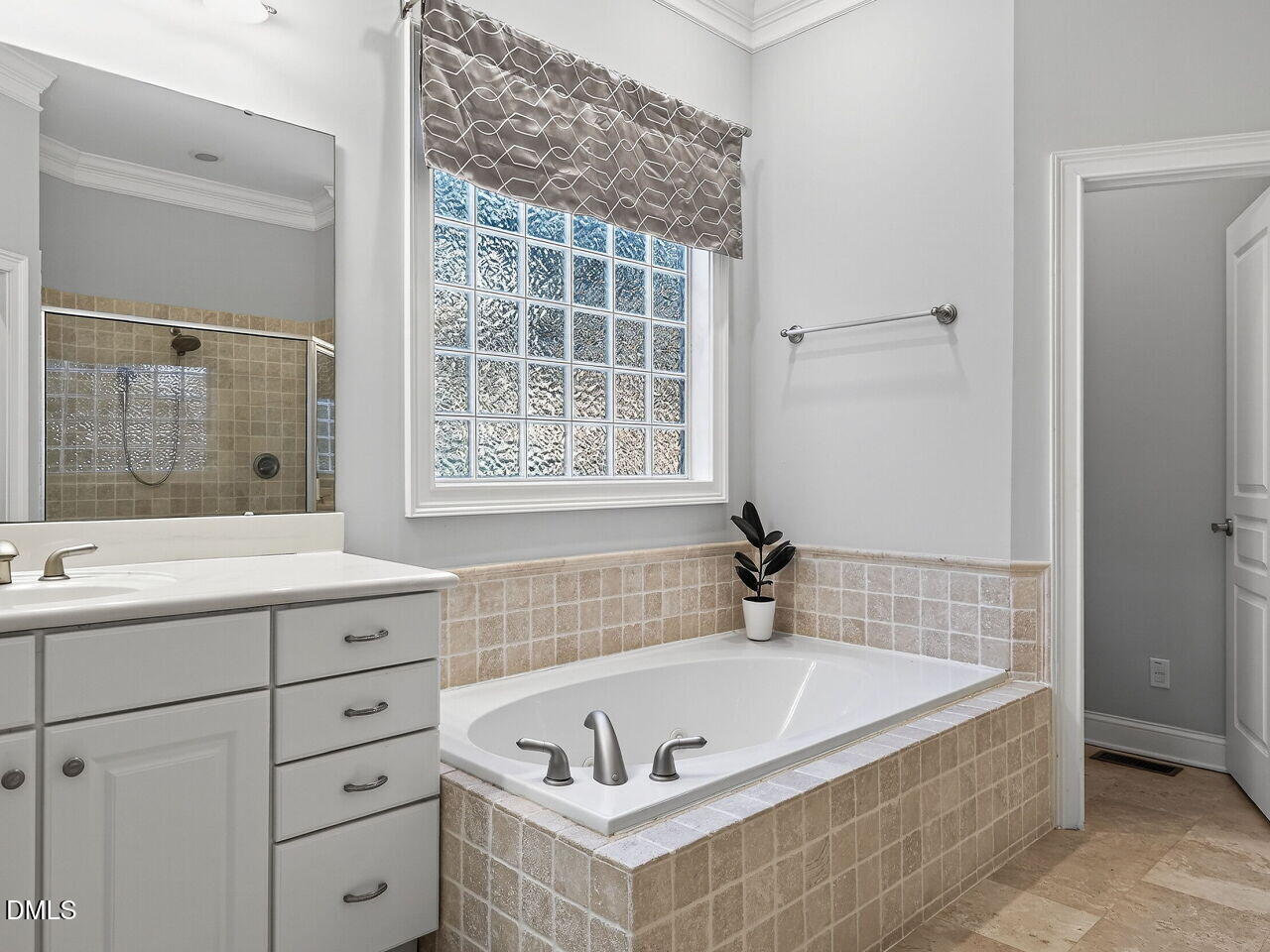 104 River Run Road Durham, NC 27712 - Photo 22 of 41 a bathroom with a tub sink and mirror