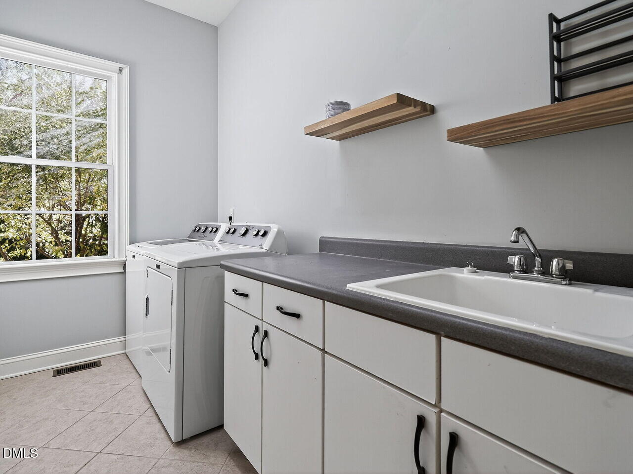 104 River Run Road Durham, NC 27712 - Photo 24 of 41 a utility room with dryer and washer