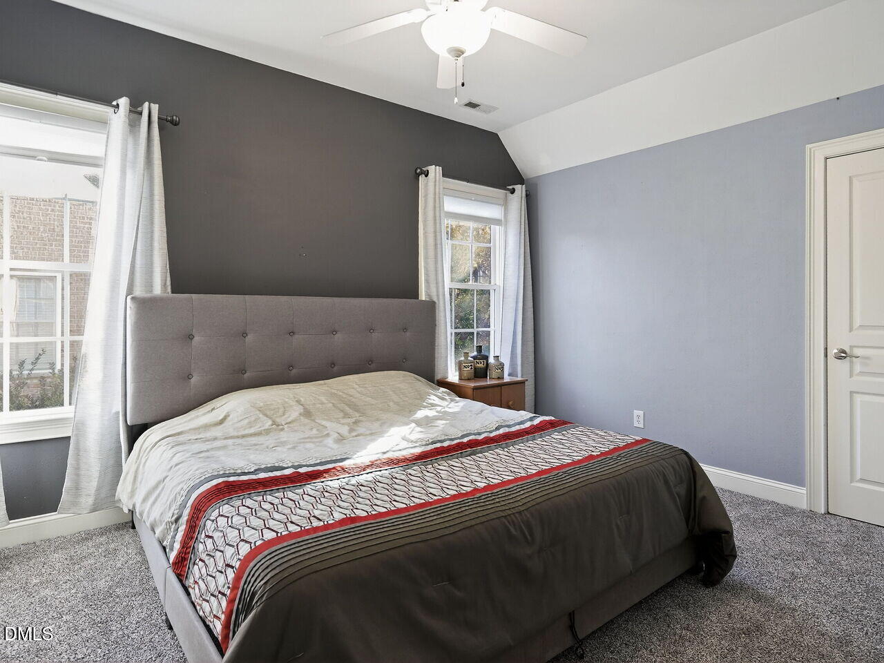 104 River Run Road Durham, NC 27712 - Photo 30 of 41 a bedroom with a bed and a window