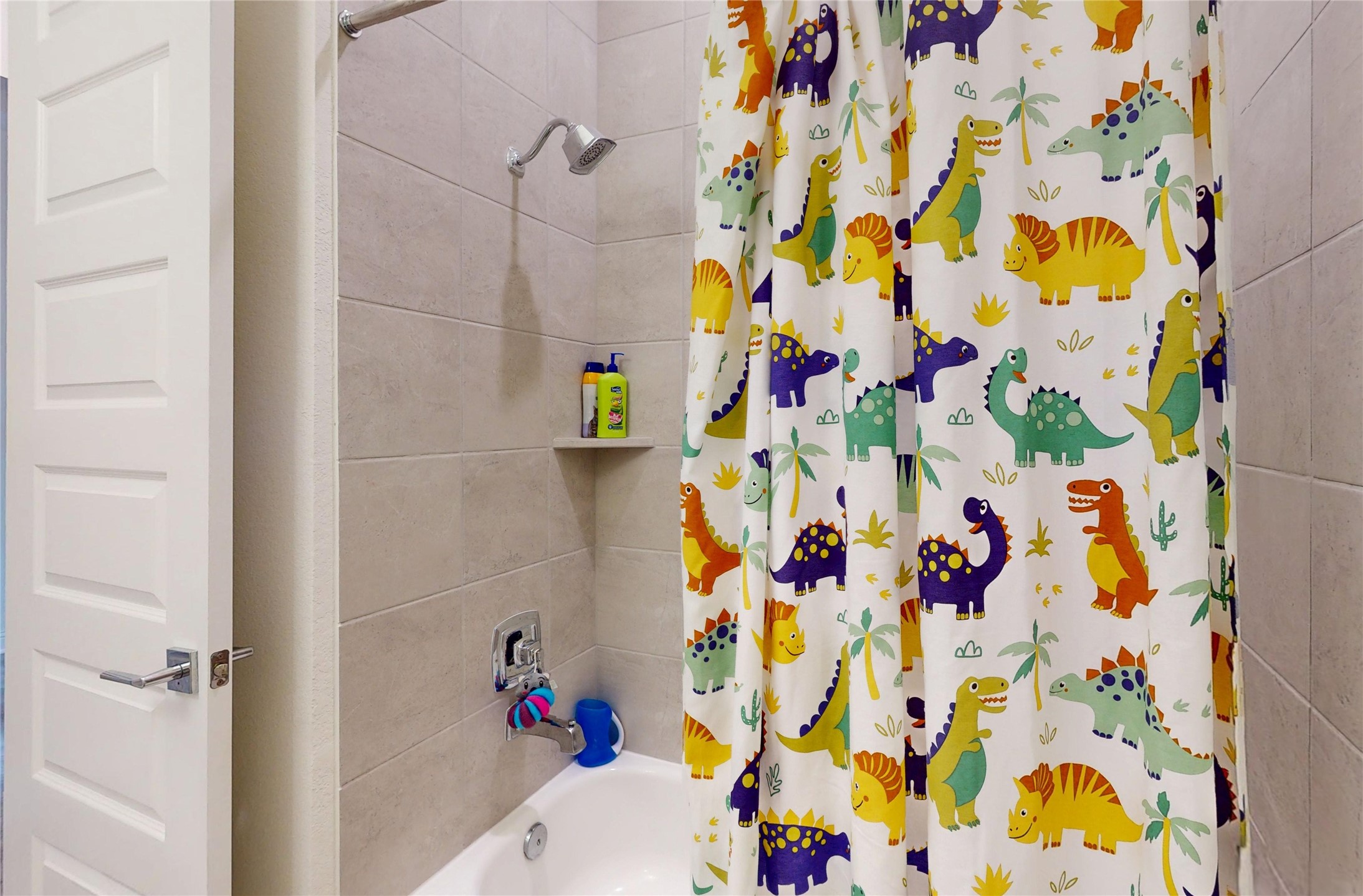 4611 Columbus Drive Manvel, TX 77583 - Photo 7 of 10 a bathroom with a sink curtain and a shower curtain