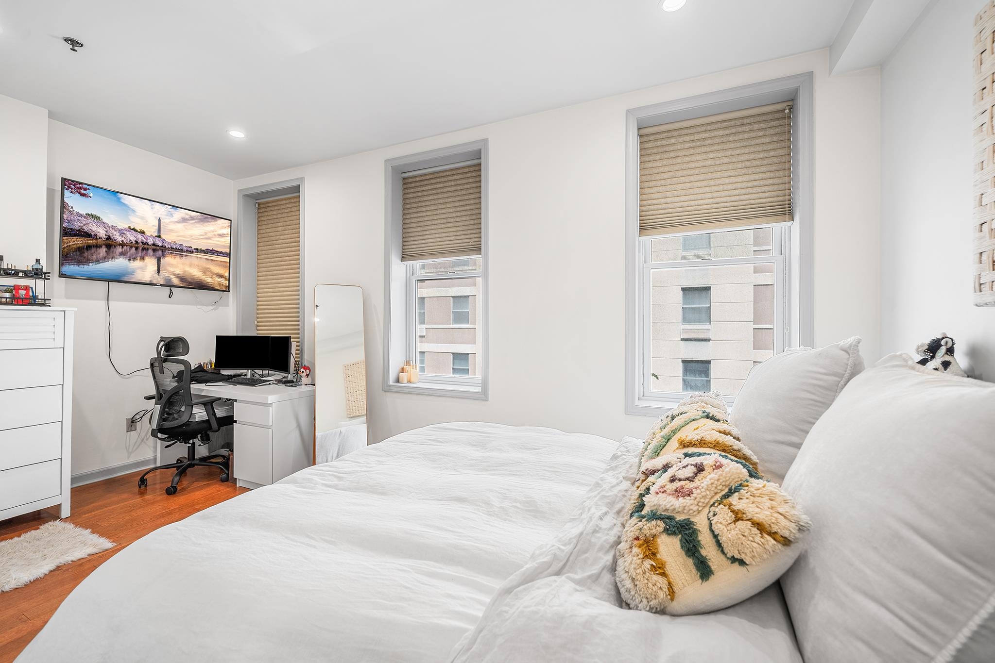 307 1st Street, Unit 2 Hoboken, NJ 07030 - Photo 16 of 20 a bedroom with furniture and a flat screen tv