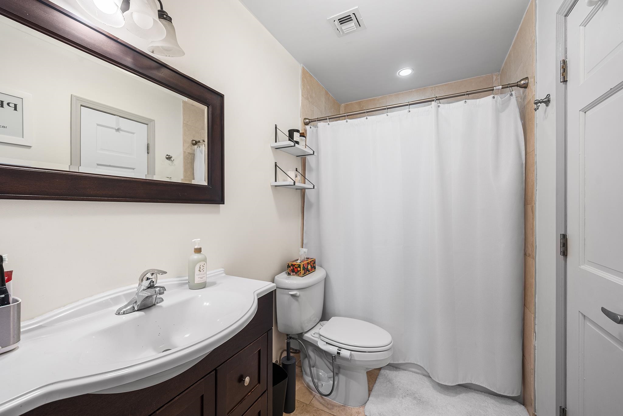 307 1st Street, Unit 2 Hoboken, NJ 07030 - Photo 17 of 20 a bathroom with a sink toilet and shower
