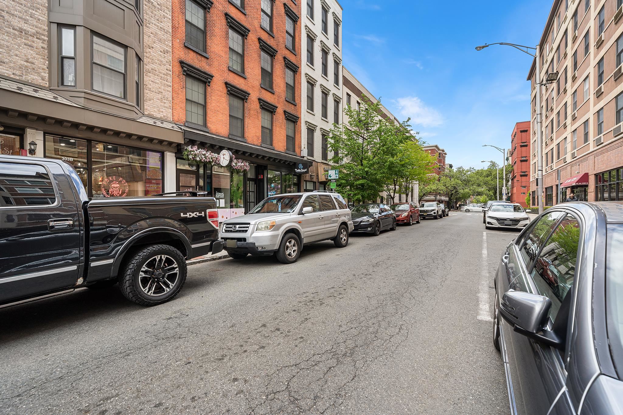 307 1st Street, Unit 2 Hoboken, NJ 07030 - Photo 19 of 20 a view of a cars park in front of a building