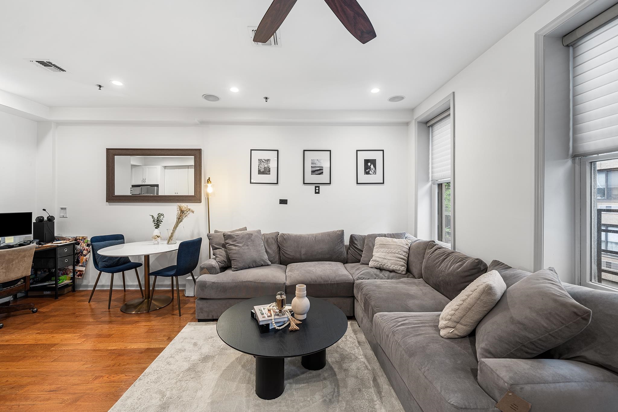 307 1st Street, Unit 2 Hoboken, NJ 07030 - Photo 9 of 20 a living room with furniture a rug and a window