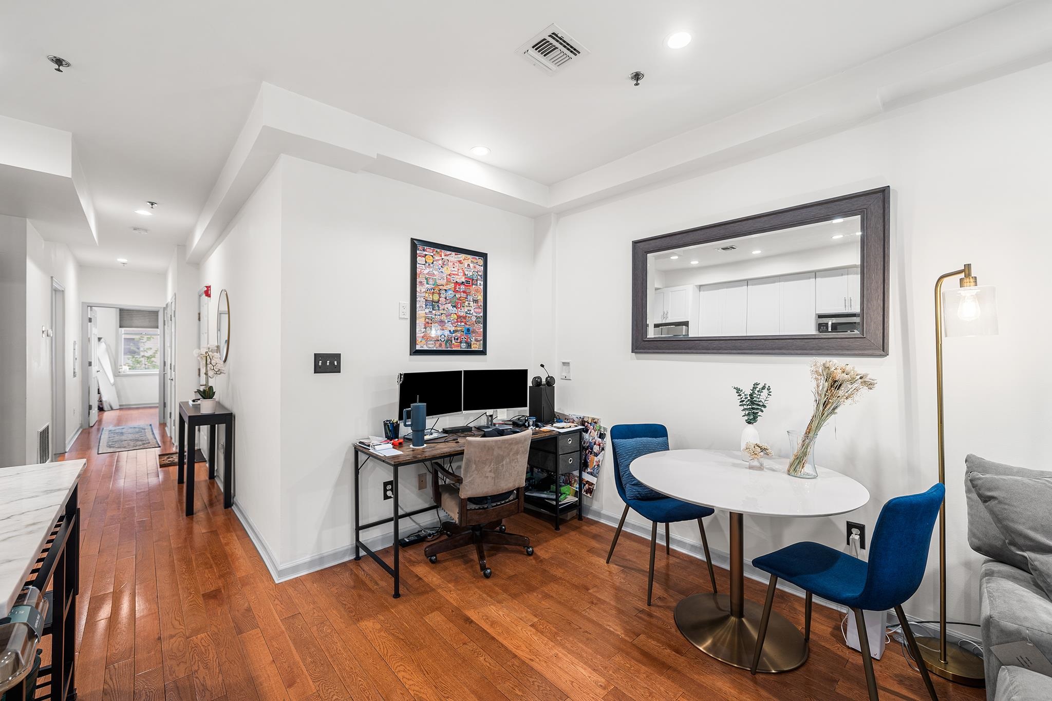 307 1st Street, Unit 2 Hoboken, NJ 07030 - Photo 10 of 20 a workspace with furniture and wooden floor