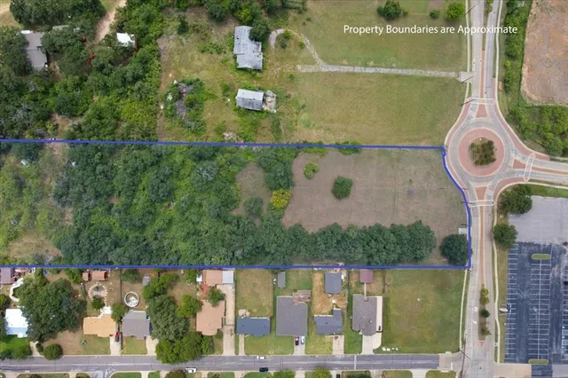 an aerial view of houses with yard