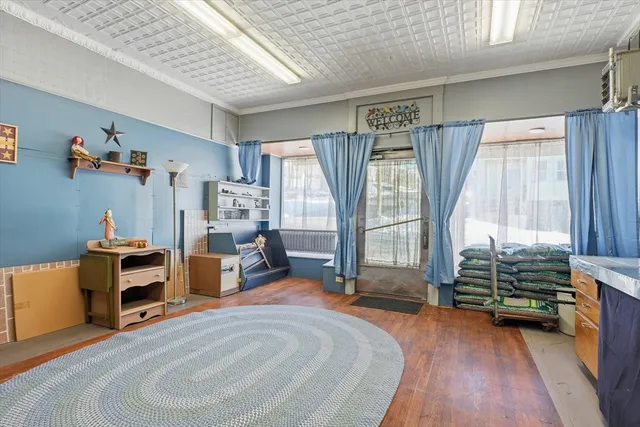 a bedroom with furniture and a flat screen tv