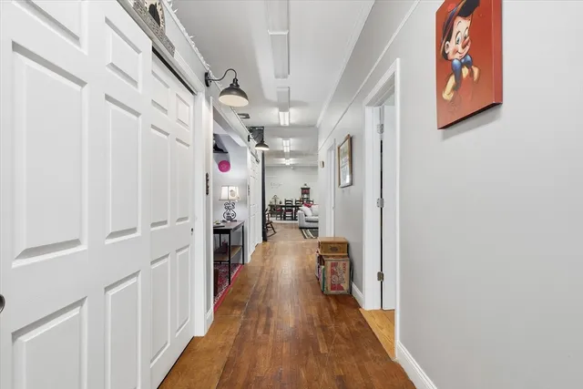 a view of a livingroom with furniture and workspace