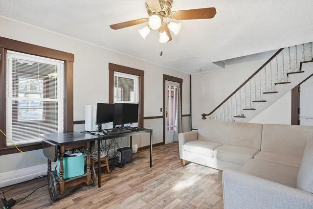 a view of kitchen with furniture and wooden floor