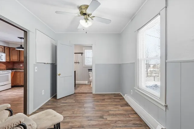 a bathroom with a sink a toilet and shower curtain