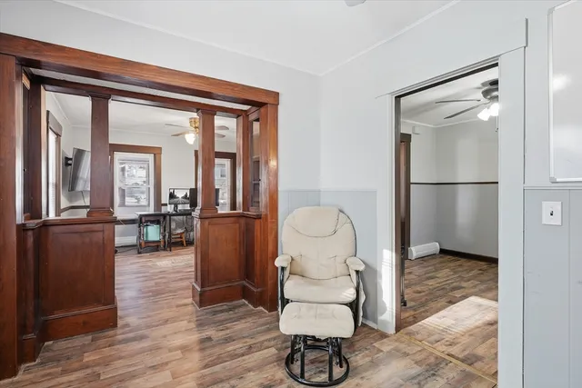 a large white kitchen with a sink a refrigerator and window