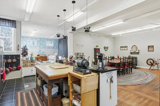 a view of a dining area with furniture and a kitchen