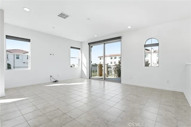 a kitchen with a stove sink and cabinets
