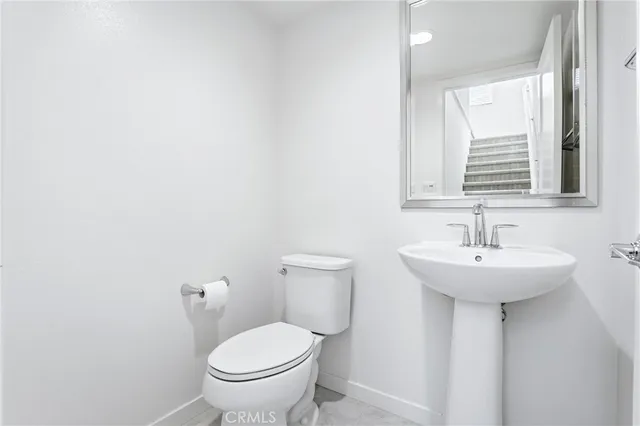 a bathroom with a shower sink and mirror