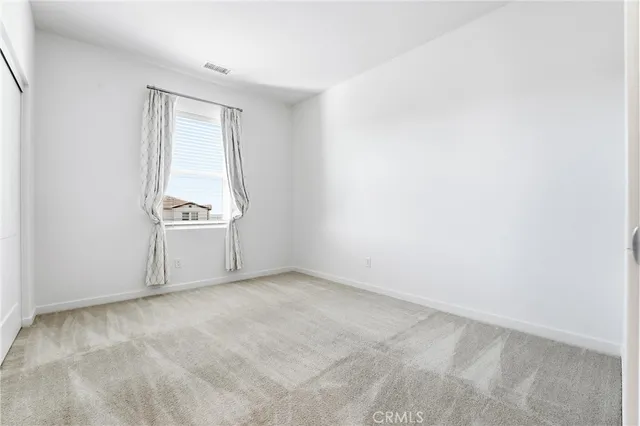 a white bath tub sitting next to a white toilet