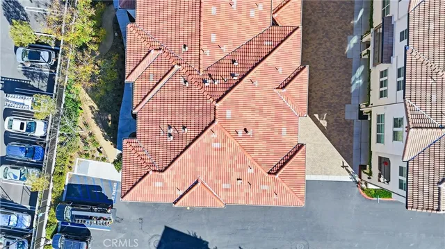 an aerial view of a swimming pool patio and outdoor seating