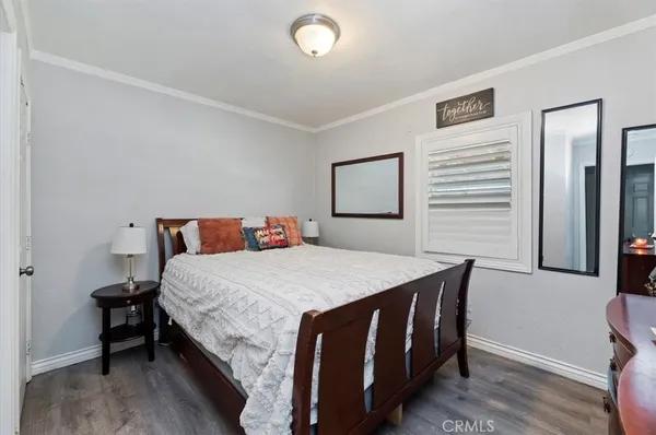 a bedroom with a bed and a table