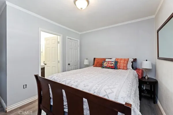 a bedroom with a bed and a table