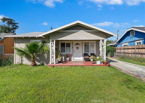 a view of a house with a yard porch and sitting area