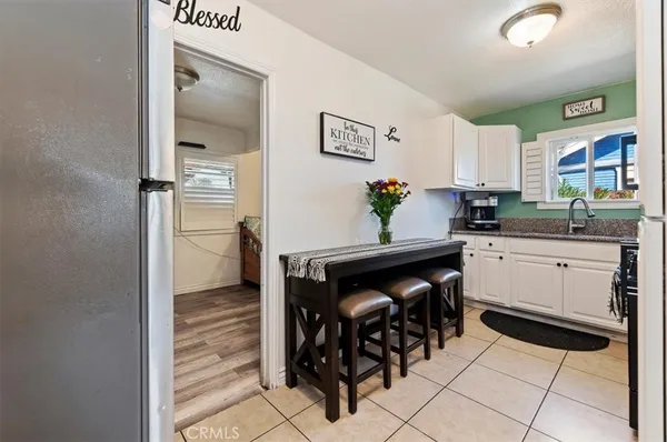 a kitchen with a sink cabinets and appliances