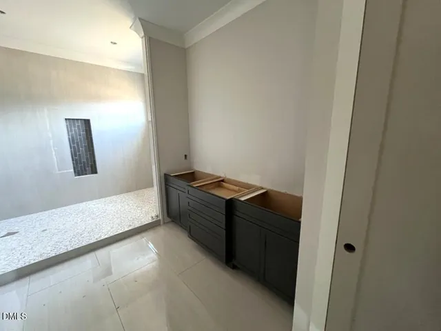 a room with a bed and a mirror