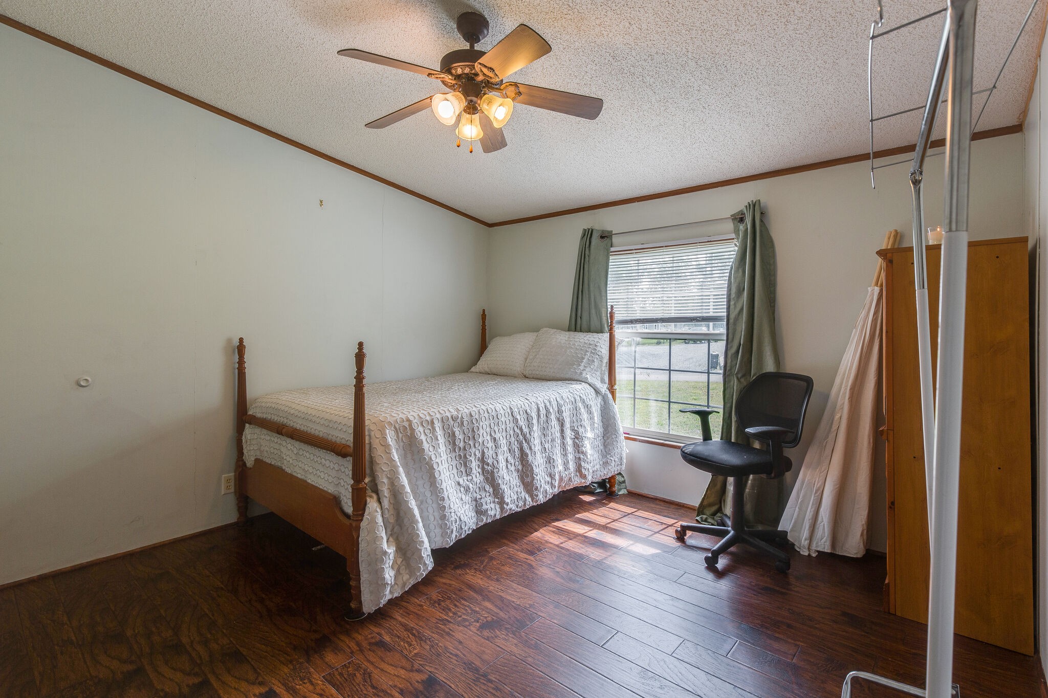 1054 Caps Ridge Dickson, TN 37055 - Photo 17 of 23 a bedroom with a bed and a chandelier