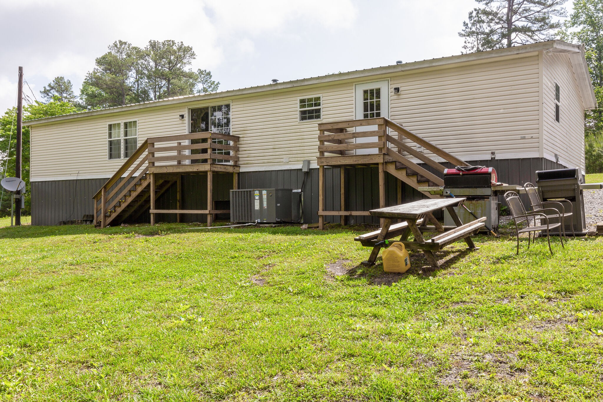 1054 Caps Ridge Dickson, TN 37055 - Photo 22 of 23 a view of a house with a backyard and wooden deck