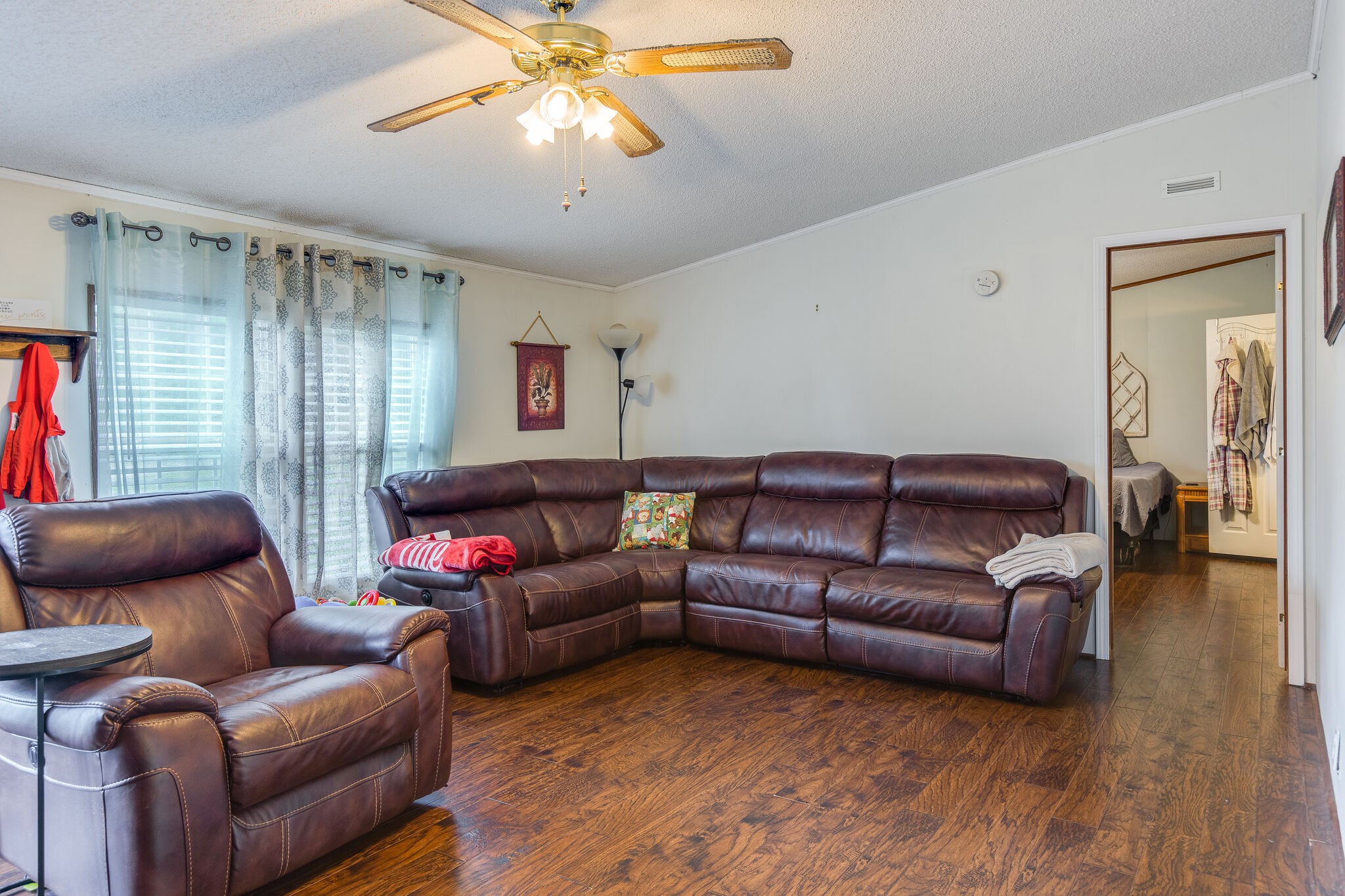 1054 Caps Ridge Dickson, TN 37055 - Photo 6 of 23 a living room with furniture ceiling fan and a wooden floor