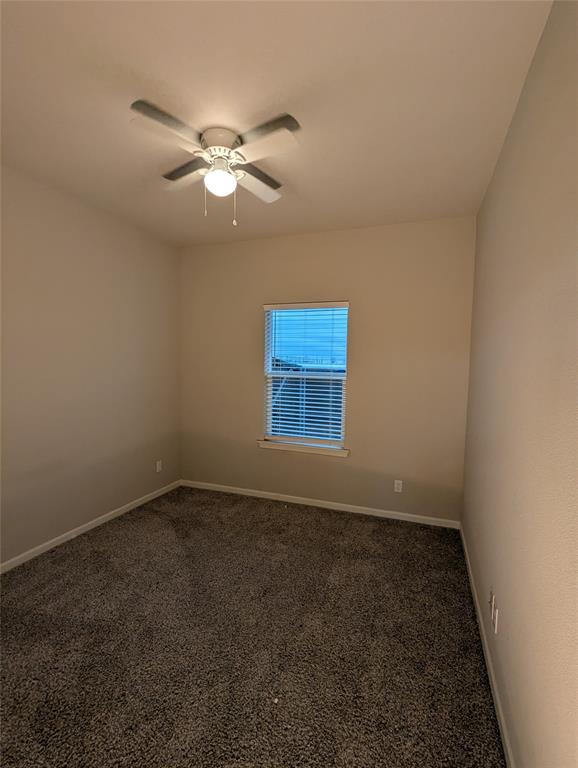 2700 Ginger Court Sherman, TX 75092 - Photo 12 of 22 a view of a room with a ceiling fan and a window