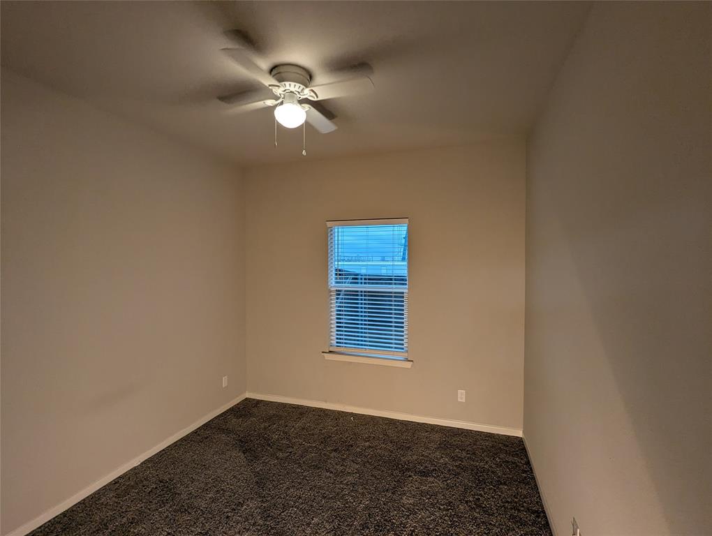 2700 Ginger Court Sherman, TX 75092 - Photo 16 of 22 an empty room with windows and fan