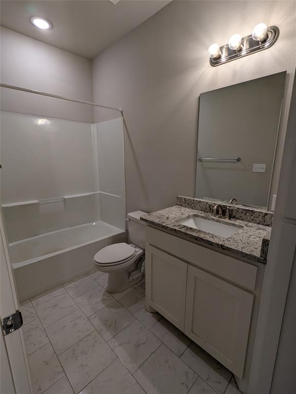 2700 Ginger Court Sherman, TX 75092 - Photo 20 of 22 a bathroom with a granite countertop sink toilet and shower