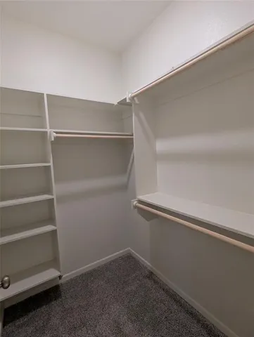 a view of an empty walk in closet