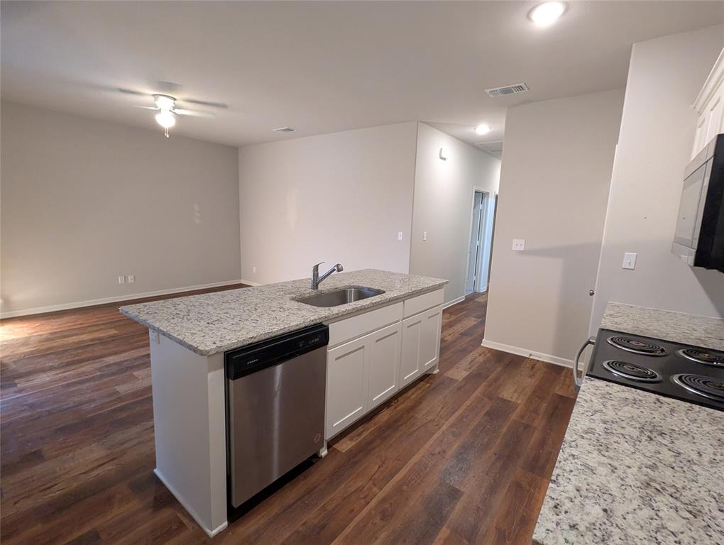2700 Ginger Court Sherman, TX 75092 - Photo 7 of 22 a kitchen with a sink and wooden floor