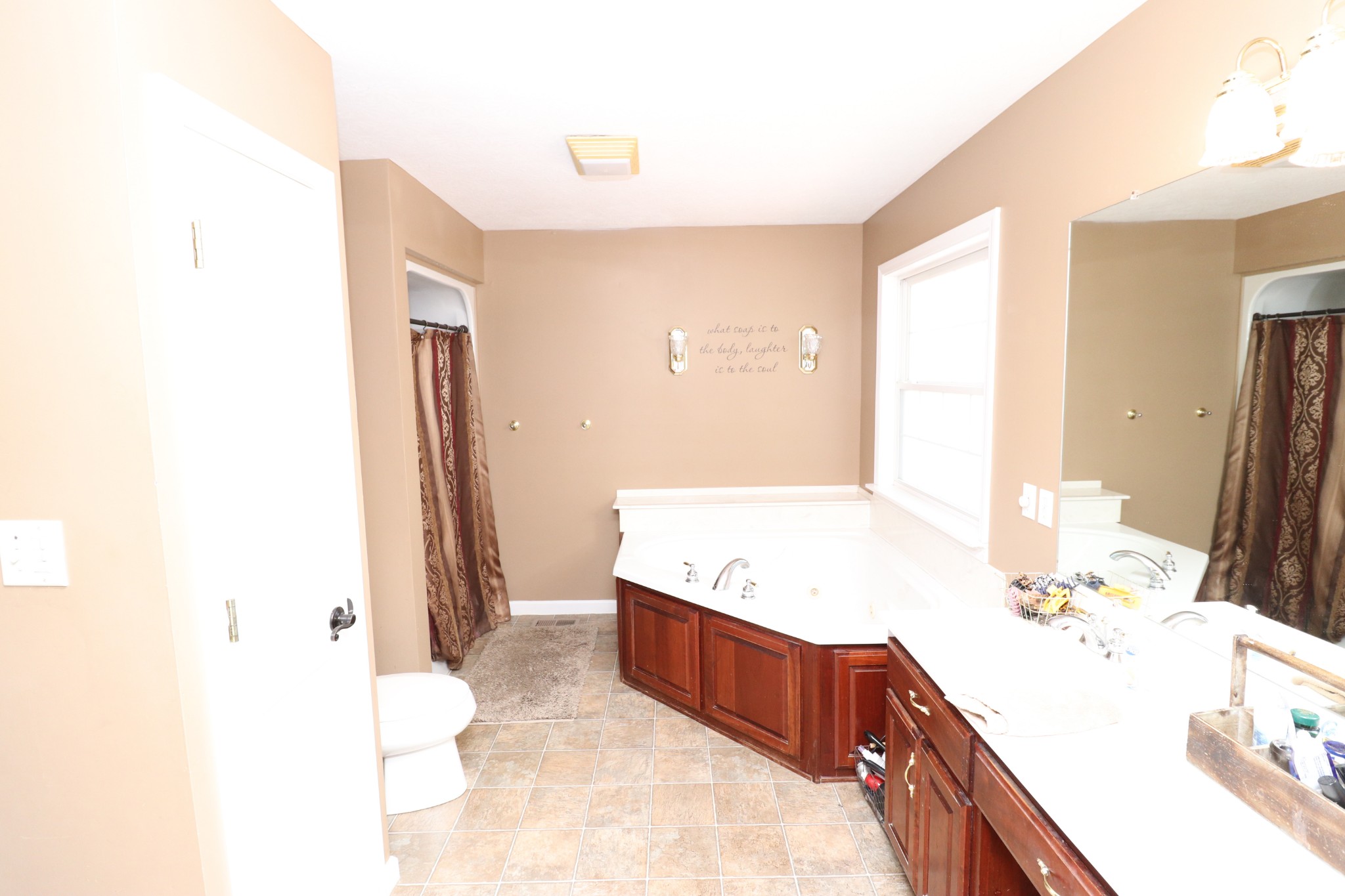 4753 Akersville Road Lafayette, TN 37083 - Photo 19 of 50 a spacious bathroom with a tub sink and mirror