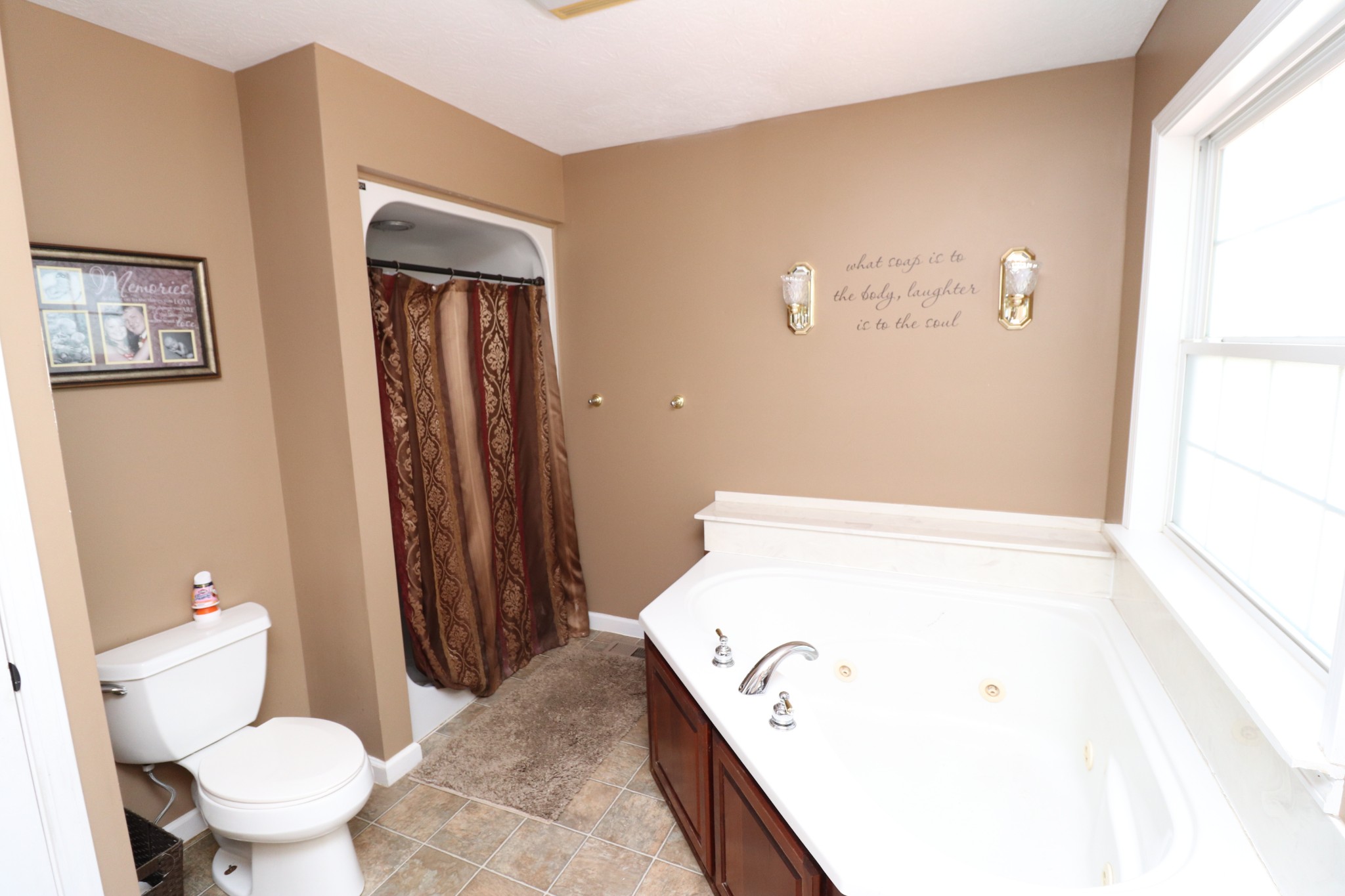 4753 Akersville Road Lafayette, TN 37083 - Photo 20 of 50 a bathroom with a bathtub and a toilet