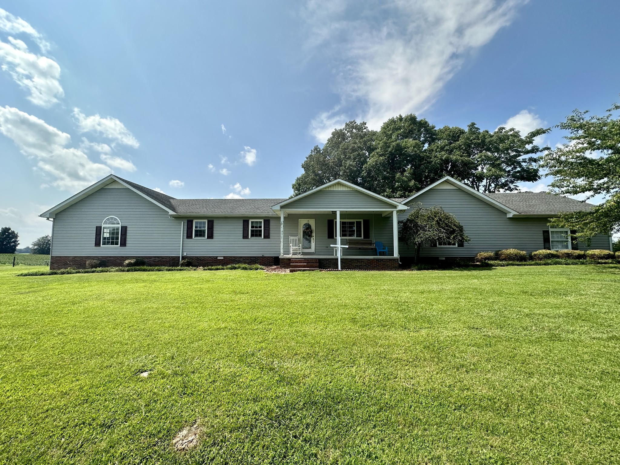 4753 Akersville Road Lafayette, TN 37083 - Photo 2 of 50 a front view of house with a garden and deck