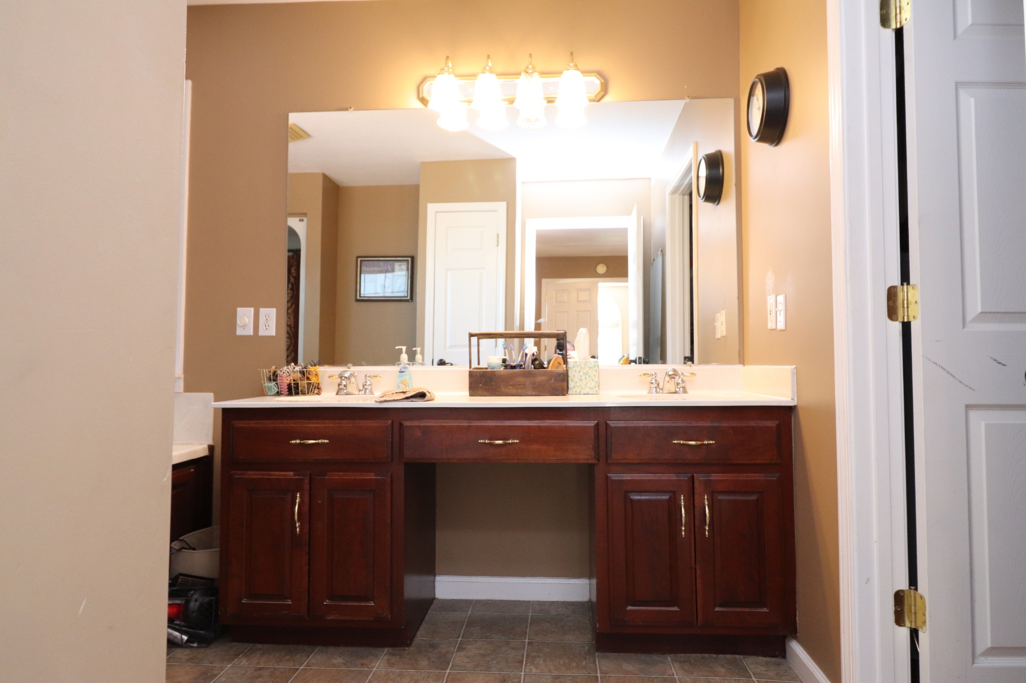 4753 Akersville Road Lafayette, TN 37083 - Photo 23 of 50 a bathroom with a double vanity sink and a mirror