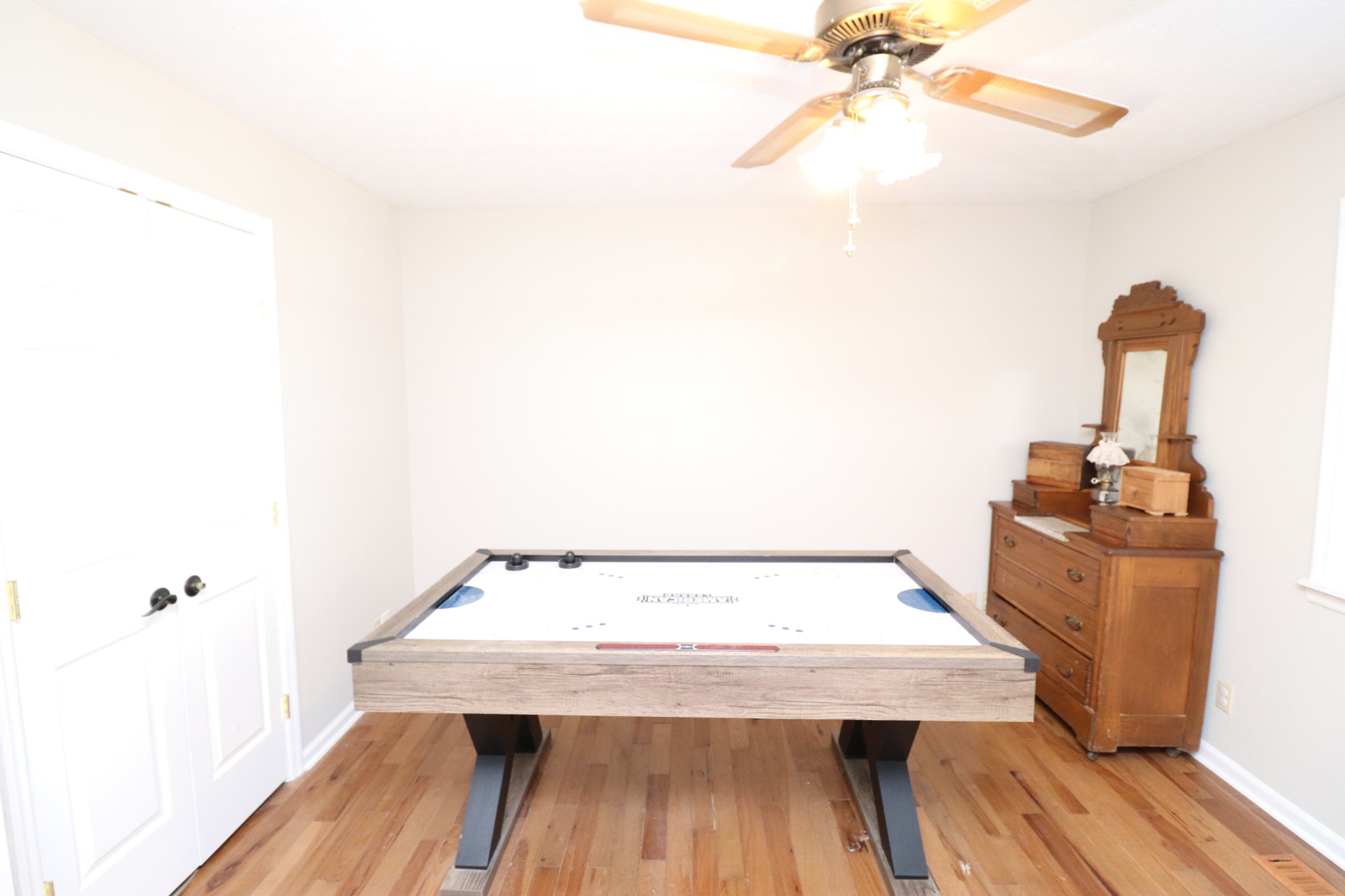 4753 Akersville Road Lafayette, TN 37083 - Photo 30 of 50 a view of a room with wooden floor and fan
