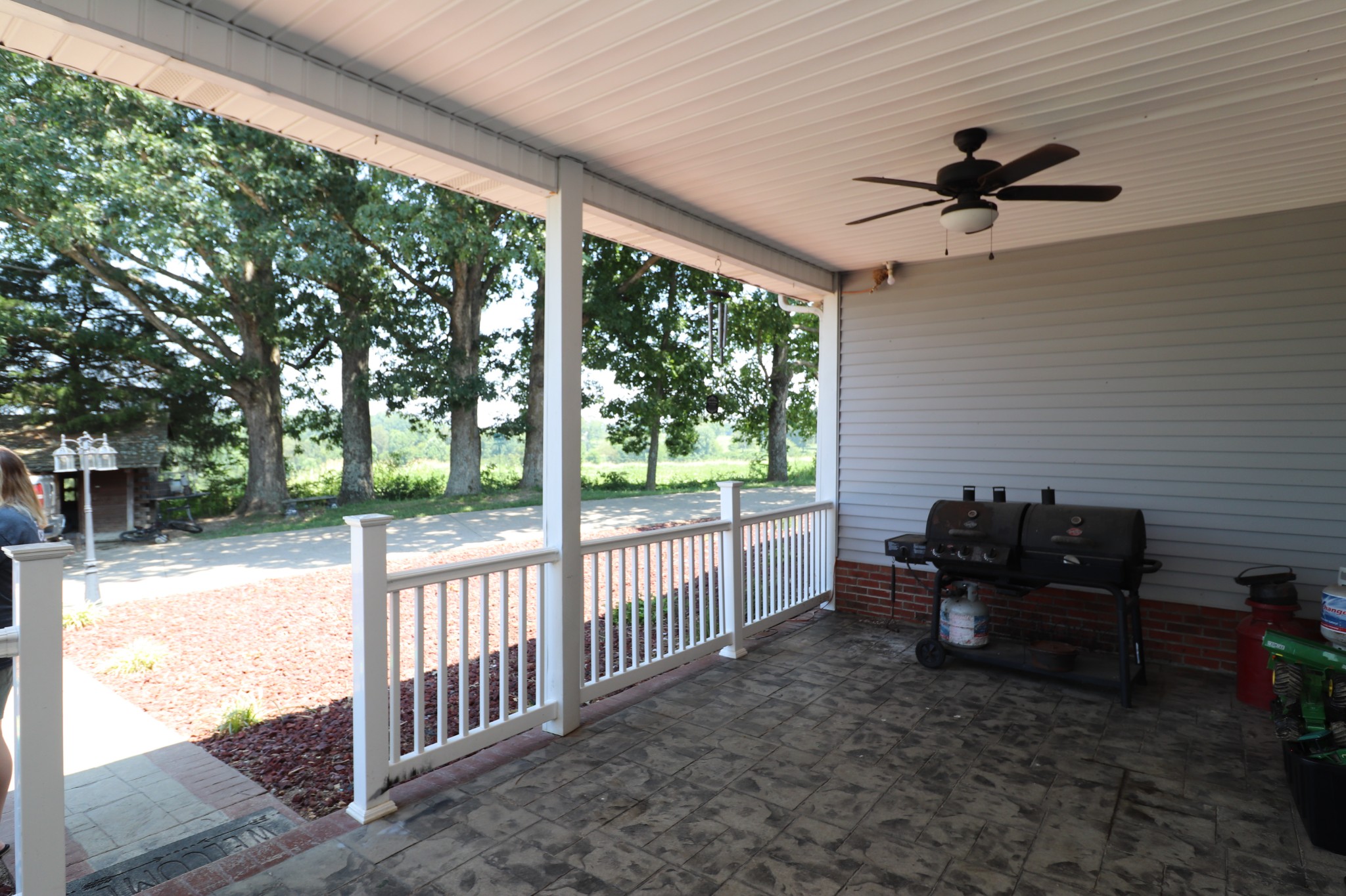4753 Akersville Road Lafayette, TN 37083 - Photo 38 of 50 a view of a porch with furniture and a yard