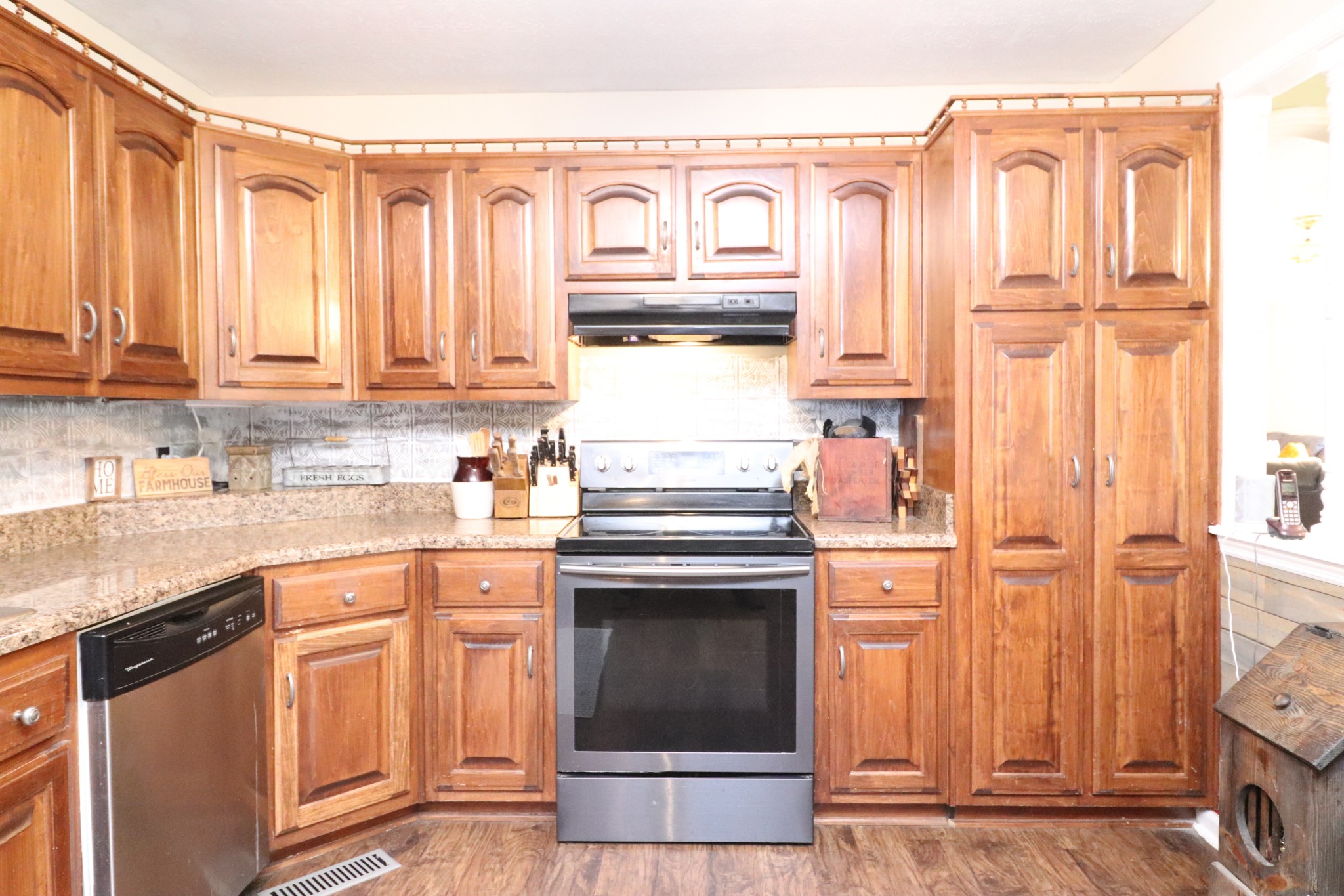 4753 Akersville Road Lafayette, TN 37083 - Photo 5 of 50 a kitchen with stainless steel appliances granite countertop a stove and a refrigerator