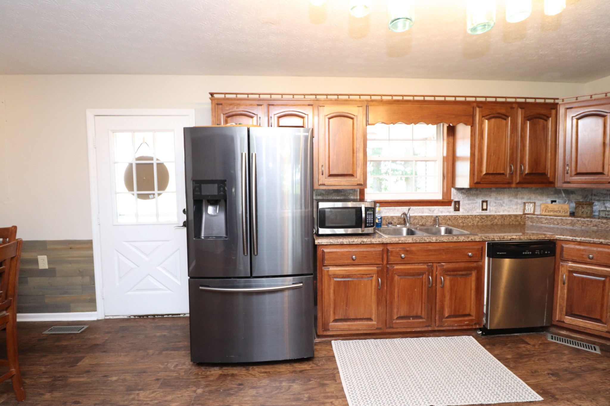 4753 Akersville Road Lafayette, TN 37083 - Photo 6 of 50 a kitchen with stainless steel appliances granite countertop a refrigerator a sink a stove and island