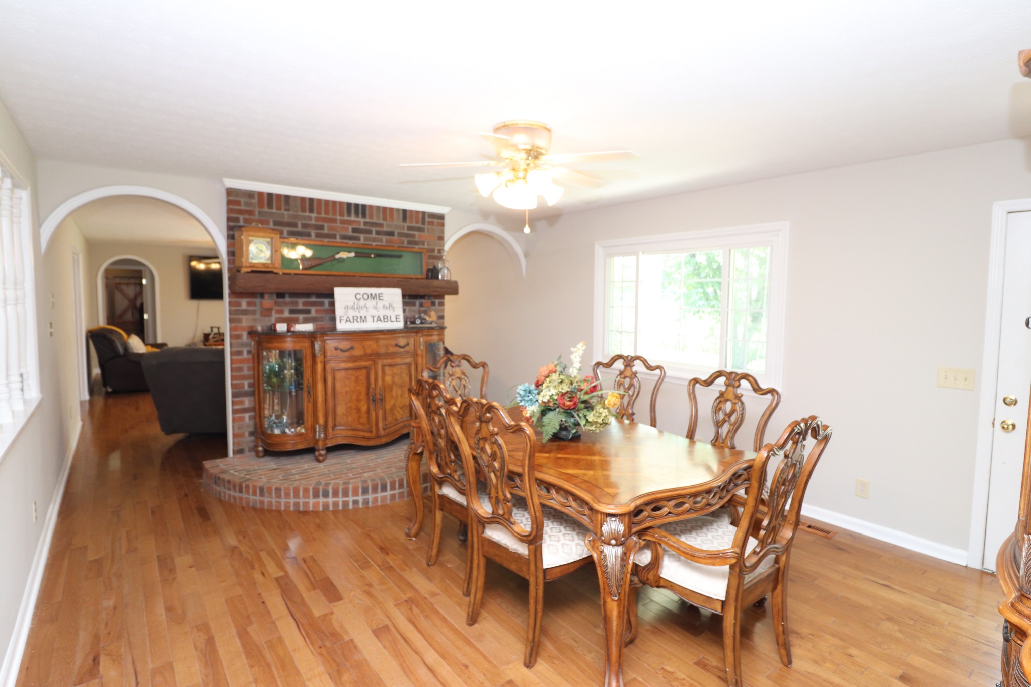 4753 Akersville Road Lafayette, TN 37083 - Photo 9 of 50 a view of a dining room with furniture a chandelier and wooden floor