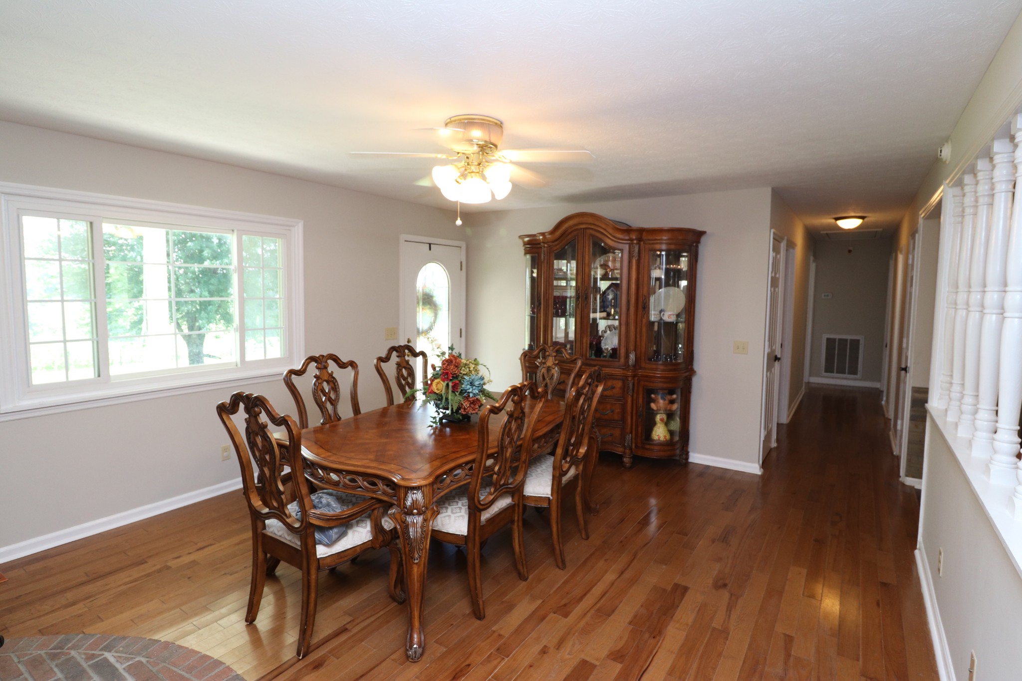 4753 Akersville Road Lafayette, TN 37083 - Photo 10 of 50 a view of a dining room with furniture window and wooden floor