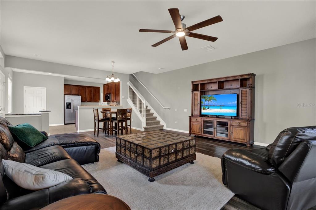 10228 Red Currant Court Riverview, FL 33578 - Photo 11 of 37 a living room with furniture and a ceiling fan