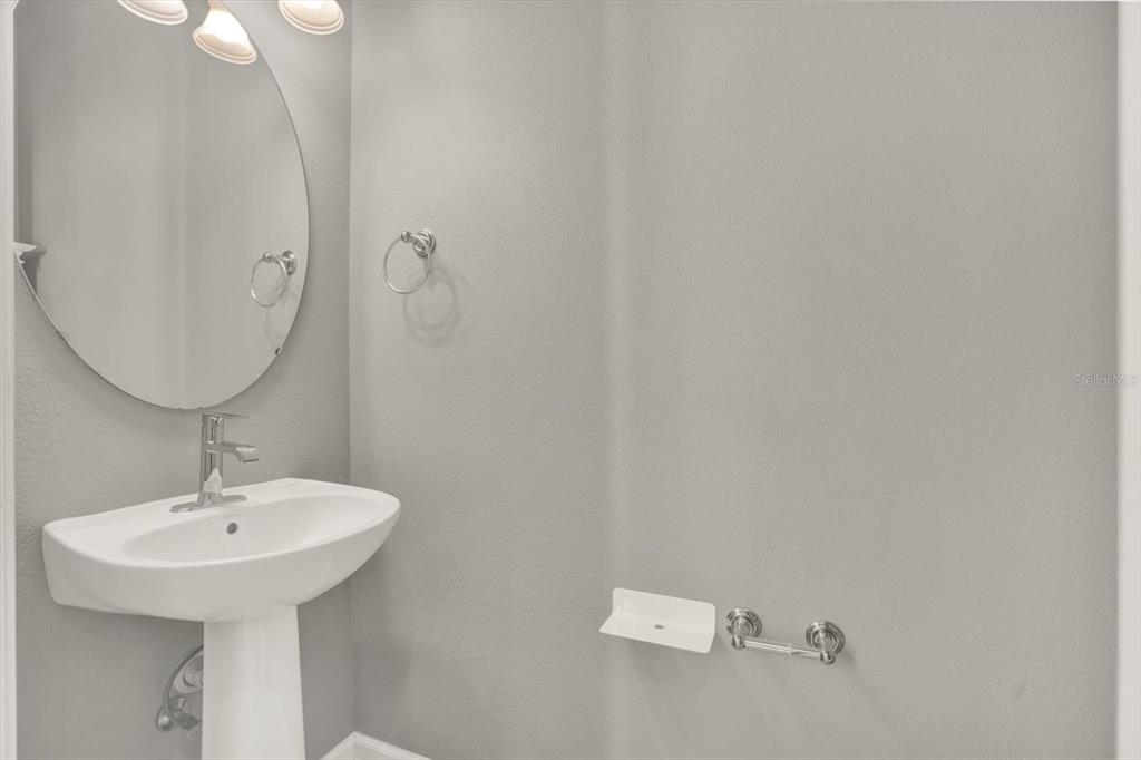10228 Red Currant Court Riverview, FL 33578 - Photo 18 of 37 a bathroom with a sink and mirror